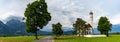 Panorama landscape view with St. Coloman church and Neuschwanstein Castle in southern Bavaria