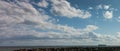 panorama of a container ship leaving Melbourne harbour bay entering international shipping waters on a sunny blue sky day