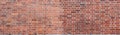 Panorama of large red brick wall with white grouting. Textured old vintage brick background Royalty Free Stock Photo