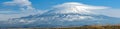 Panorama of the lenticular clouds surrounding Mount Shasta after a fresh snowfall, California, USA Royalty Free Stock Photo