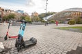 Panorama of a Liege street with dockless electric scooters for rent, in Belgium, offering an eco-friendly, convenient & modern