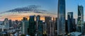 Light spotted clouds in front of an orange glow of sunset looking over downtown San Francisco Royalty Free Stock Photo