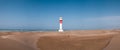 panorama of lighthouse on a sunny day in Punta del Fangar. Ebro Delta. Royalty Free Stock Photo