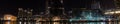 Panorama of lights on skyscrappers and buildings around lake in Royalty Free Stock Photo