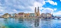 Limmat river with Munsterbrucke bridge and Grossmunster with houses on the river\'s bank, Zurich, Switzerland