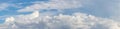 Panorama with a long white cloud on a blue sky Royalty Free Stock Photo