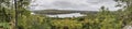 Panorama Looking Out Over a Lake Surrounded by Forest in Autumn Royalty Free Stock Photo