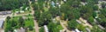 Panorama low density housing of mobile manufactured homes surrounding by lush green trees near Richland Westside Park, suburb