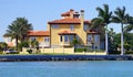 Panorama of Luxury beach house with boat dock Royalty Free Stock Photo