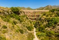 A panorama of the majestic, four storey, Eagle Aqueduct that spans the ravine of Cazadores near Nerja, Spain Royalty Free Stock Photo