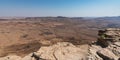 Panorama of the Makhtesh Ramon Crater and Cliff Ledge in Israel Royalty Free Stock Photo