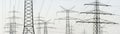 Panorama of many electric pylons for energy supply Royalty Free Stock Photo