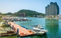 Panorama of marina and Sanya river view with boats and city buildings in Sanya city Hainan China