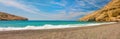 Panorama of Matala, beautiful beach on Crete island, waves and rocks. Royalty Free Stock Photo