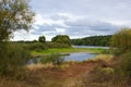 Panorama meander river with reed on northern part of Ukraine, Sumy region. Riparian vegetation Salix sp. Flooded meadow