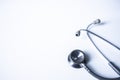 Panorama of medical stethoscope on white blur background with copy space inside hospita