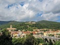 Panorama of medieval walled town of Prats-de-Mollo with church of Saint-Juste-et-Sainte-Ruffine, Fort Lagarde, old stone bridge Royalty Free Stock Photo