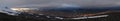 Panorama of midnight sun shinig over the mountains Royalty Free Stock Photo