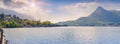 Panorama of the misty morning on the same town and lake Lecco