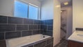 Panorama Modern bathroom interior with grey tiled walls Royalty Free Stock Photo
