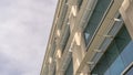 Panorama Modern office building exterior viewed against cloudy sky on a sunny day Royalty Free Stock Photo