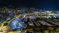 Panorama of Monte Carlo timelapse at night from the observation deck in the village of Monaco with Port Hercules Royalty Free Stock Photo