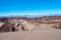 Moonlike landscape of dunes, rugged mountains and rock formations of Valle de la Luna Moon valley, Atacama desert, Chile Royalty Free Stock Photo