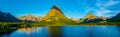 0000292_Panorama of a morning sunrise over Swiftcurrent Lake with  Mount Gould, Grinnell Point and  Mount Wilbur in the Royalty Free Stock Photo