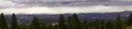 Panorama, morning thunderstorms over desert mountains