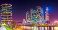 Panorama of Moscow City with reflections in Moscow river at night.