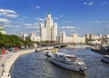 Panorama of Moscow with a skyscraper on Kotelnicheskaya embankment, Moscow river and tourist boats.