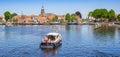 Panorama of a motorboat waiting for the lock in historic town Blokzijl