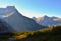 Panorama of Mount Edith Cavell. High mountains with glacier, sun rays illuminate the forest.