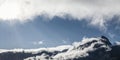 Panorama of mountain chain Hahnenkamm in Hoefen near Reutte with fog clouds