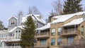 Panorama Mountain homes in Park City Utah with snow and icicles on roofs in winter Royalty Free Stock Photo