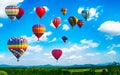 Panorama of mountain with hot air balloons on morning at Thailand. Royalty Free Stock Photo