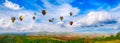 Panorama of mountain with hot air balloons on morning at Thailand. Royalty Free Stock Photo