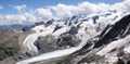 Panorama mountain landscape with high alpine peaks and torn and wild glaciers