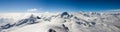 Panorama mountain landscape in the Swiss Alps near Zermatt on a beautiful day in late winter under a blue sky Royalty Free Stock Photo