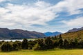 Lake Wanaka, and Mountain range of the Southern Alps on a blue sky day at Dublin Bay, in Wanaka, Otago, South Island, New Zealand Royalty Free Stock Photo