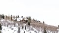 Panorama Mountain top in Park City Utah with homes that sit amid snowy slope in winter Royalty Free Stock Photo