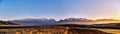 Panorama of a mountain valley in autumn evening. Fairytale sunset over the mountain peaks, amazing nature of the foothills, autumn