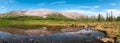 Panorama of mountain valley with calm clear water of the lake. Khibiny Mountains is on Kolsky Peninsula, northern Russia Royalty Free Stock Photo