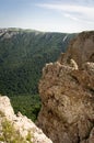 Panorama in a mountainous area in summer. Landscape with mountains, hills and cliffs. Royalty Free Stock Photo
