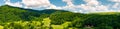 Panorama of mountainous rural area in summer Royalty Free Stock Photo