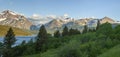 Panorama of mountains in Glacier National Park above Lower Two Medicine Lake in the morning Royalty Free Stock Photo