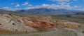 Panorama of the mountains. Magnificent views of the Altai mountains of red against the blue sky. Siberia, Altai