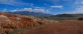 Panorama of the mountains. Magnificent views of the Altai mountains of red against the blue sky. Siberia, Altai