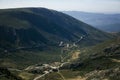 A panorama of mountains with a winding road in Serra da Estrela, Portugal. Royalty Free Stock Photo