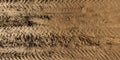 panorama of muddy road from above on surface of wet gravel road with tractor tire tracks in countryside Royalty Free Stock Photo